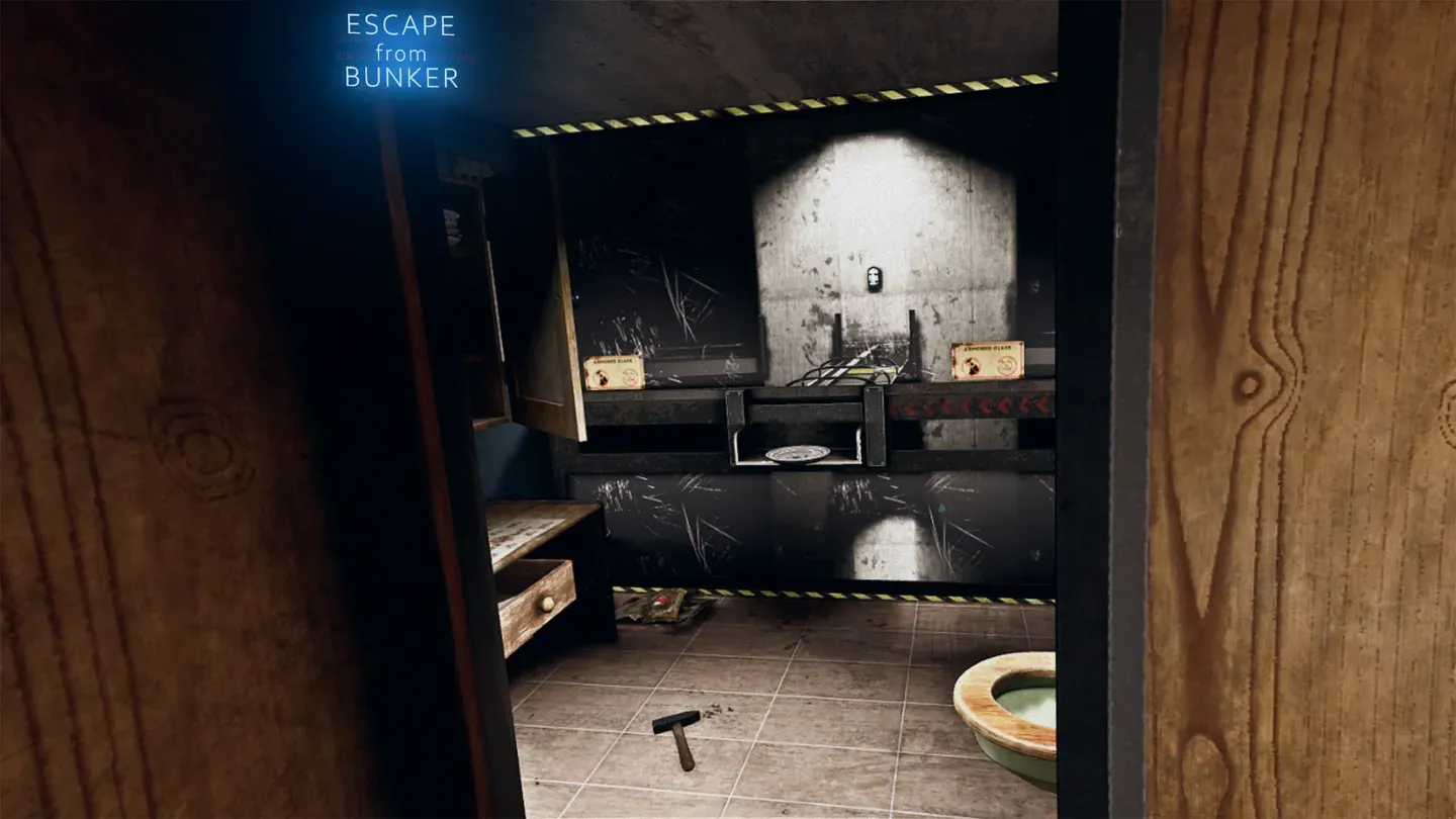 A bunker bathroom with a hammer on the floor