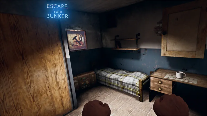 A small bunker bedroom with a bunk and a desk